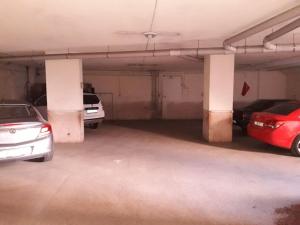 a parking garage with cars parked in it at YILDIZ HOTEL in Altındağ