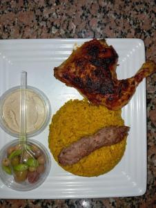 a plate of food with a piece of meat and peas at ايركرافت للسياحه العلاجيه Aircraft for Medical Tourism And Investment 