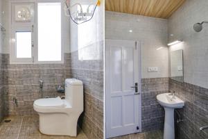 a bathroom with a toilet and a sink at FabHotel Himalayan Park in Bajaura