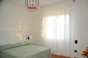 Voodi või voodid majutusasutuse Hotel Sette Note toas