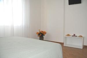 Voodi või voodid majutusasutuse Hotel Sette Note toas
