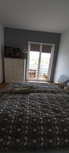 Letto o letti in una camera di Onix-Vital Apartman Orfű