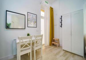 a dining room with a table and two chairs at (J4) Loft Céntrico Madrid Retiro A estrenar in Madrid