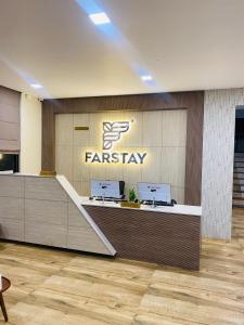an office lobby with a farsiology sign on the wall at Mount view by farstay in Wayanad