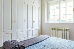 A bed or beds in a room at Casa la Fontana - Hostatel