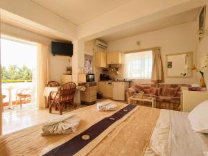 a living room with a couch and a table in a room at evli in Rethymno +22 photos