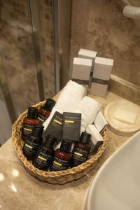 a basket of bathroom products on a bathroom counter at VillaQua Boutique Hotel in Şile