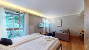 Postel nebo postele na pokoji v ubytování Abitaziun Residence 10A - St Moritz