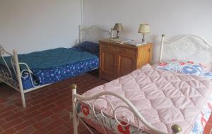 a bedroom with two beds and a wooden dresser at Gîte G3098 in Montferrat +6 photos
