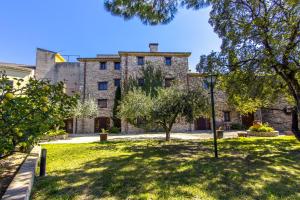 an exterior view of a large stone building at Catalunya Casas Timeless Elegance near Barcelona, 14 min to beach in Santa Oliva