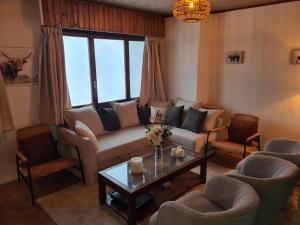Posezení v ubytování Auberge de l'Ours
