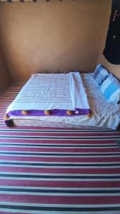 Letto o letti in una camera di Mhamid yaya camp & activités