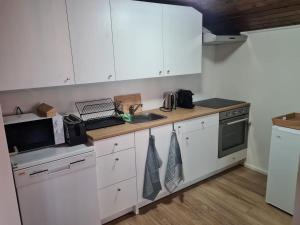 Kuchyň nebo kuchyňský kout v ubytování Auberge de l'Ours