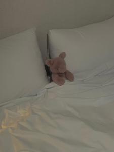 a teddy bear sitting on top of a bed at Can feel real Local Seoul - Foreign guests only in Seoul