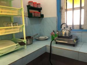 a kitchen with a tea kettle on the counter at Sunset Beach Cabana in Ambalangoda