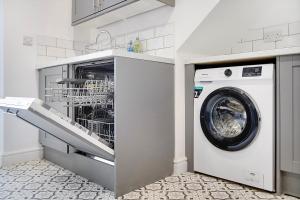 a white washer and dryer in a kitchen at Dean St Retreat - Cosy Urban Escape, Sleeps 5 in Hexham