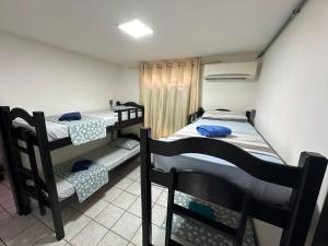 Voodi või voodid majutusasutuse Pousada Dunas Natal toas