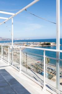 a balcony with a view of the beach at Maria Paola penthouse aan het strand in Fuengirola