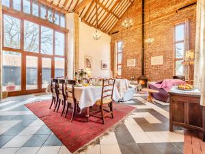 a dining room with a table and chairs at St Marys Chapel in New Buckenham