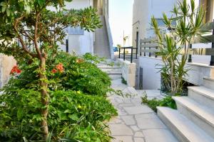 a garden with a tree and some plants at Anastasia mare home #A# in Rethymno