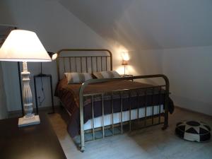 A bed or beds in a room at Gite Nuance