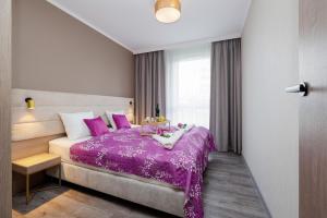 Posteľ alebo postele v izbe v ubytovaní Perfect Holiday Apartments Bel Mare by Noclegi Renters