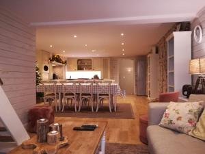 a dining room and kitchen with a table and chairs at Maison Marie in Poperinge