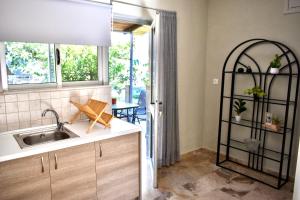a kitchen with a sink and a window at Anastasia mare home #A# in Rethymno Town +62 photos