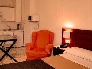 A bed or beds in a room at Apartamentos Vértice Bib Rambla