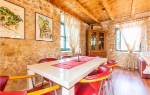 A restaurant or other place to eat at 1 Bedroom Lovely Home In Vrgorac