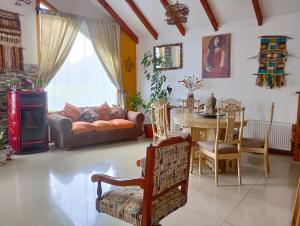 a living room with a couch and a table at Habitaciones Punto Medio 1 in Puerto Varas