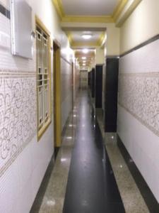 an empty hallway with a long corridor at Hotel Chancellor,Bhubaneswar in Bhubaneshwar