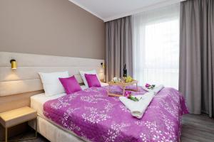 Posteľ alebo postele v izbe v ubytovaní Perfect Holiday Apartments Bel Mare by Noclegi Renters + 37 fotografií