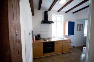 a kitchen with a sink and a stove top oven at NEU! FeWo Winkeleck in Alsfeld