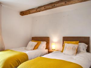 Llit o llits en una habitació de Daffodil Cottage