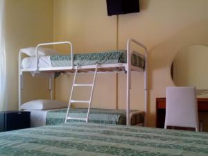 Voodi või voodid majutusasutuse Hotel Sette Note toas