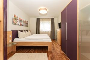 Säng eller sängar i ett rum på Appartementhaus Crystal by Schladming-Appartements