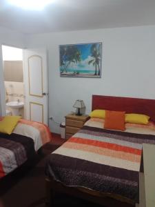 Säng eller sängar i ett rum på Hospedaje Punta Hermosa
