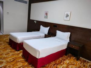 En eller flere senger på et rom på فندق الرابح AlRabih hotel