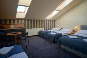 En eller flere senge i et værelse på Apartments ALKANTARA