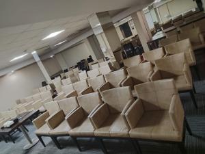 an empty auditorium with empty chairs in a room at May park HOTEL in İzmir