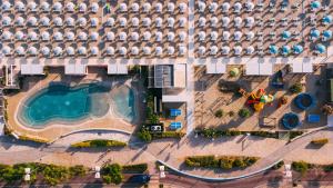 an overhead view of a large building with a swimming pool at Hotel International in Misano Adriatico