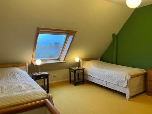 Ένα ή περισσότερα κρεβάτια σε δωμάτιο στο Wiesenhüs