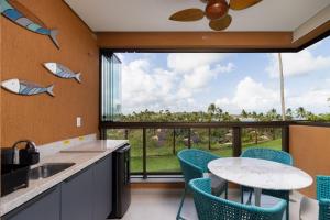 Kuchyň nebo kuchyňský kout v ubytování Apt Beira-Mar Eco Resort Praia dos Carneiros