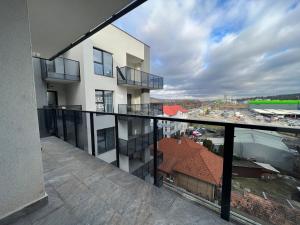 an apartment balcony with a view of a city at Exit Aparthotel in Floreşti