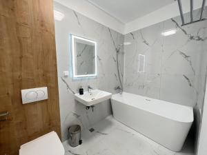 Koupelna v ubytování Exit Aparthotel + 37 fotografií