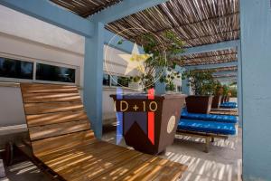 a deck with a wooden bench and a table at Condominio frente al mar con acceso directo a la playa Morros 922 in Cartagena de Indias
