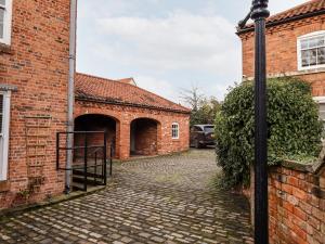 an entrance to a brick building with a gate at The Nest in Doncaster