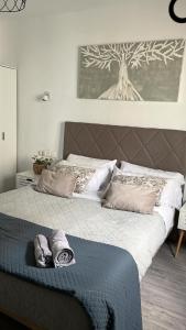 a bed with two pillows on it in a bedroom at RockBeach bungalow in Costa Teguise