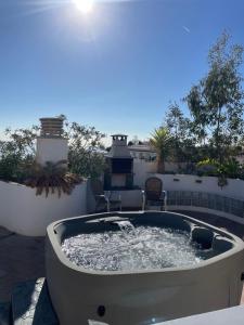a hot tub on the patio of a house at Penthouse with Private Roof terrace and jacuzzi in Fuengirola